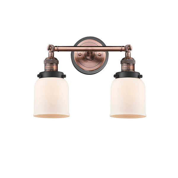Bell Bath Vanity Light shown in the Antique Copper finish with a Matte White shade