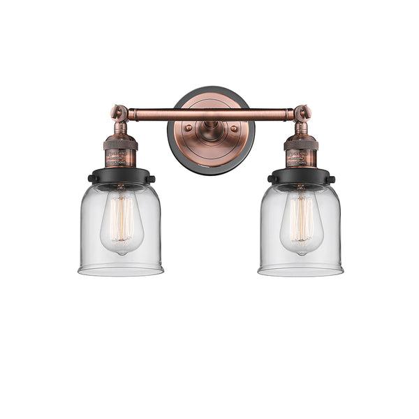 Bell Bath Vanity Light shown in the Antique Copper finish with a Clear shade