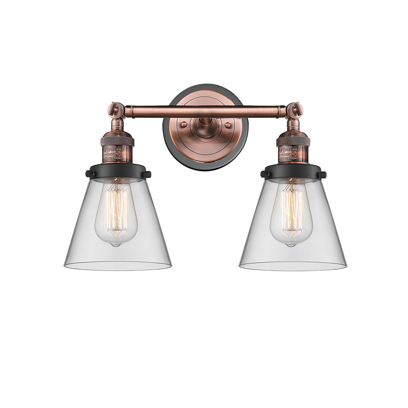 Cone Bath Vanity Light shown in the Antique Copper finish with a Clear shade