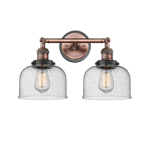 Bell Bath Vanity Light shown in the Antique Copper finish with a Seedy shade