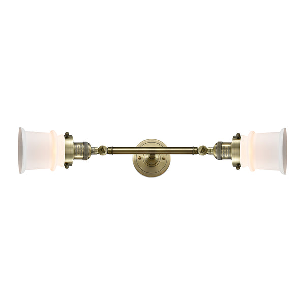 Canton Bath Vanity Light shown in the Antique Brass finish with a Matte White shade