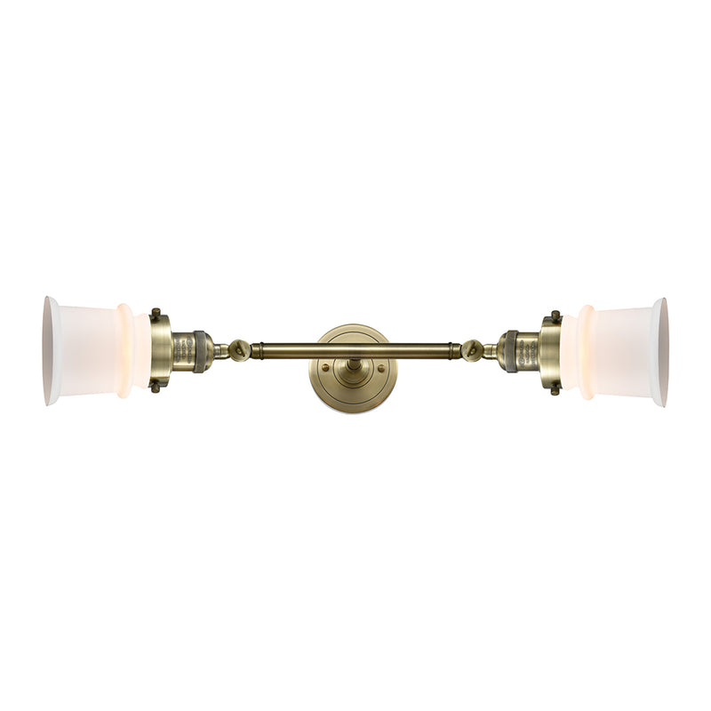 Canton Bath Vanity Light shown in the Antique Brass finish with a Matte White shade