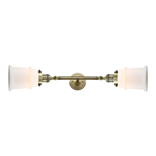 Canton Bath Vanity Light shown in the Antique Brass finish with a Matte White shade