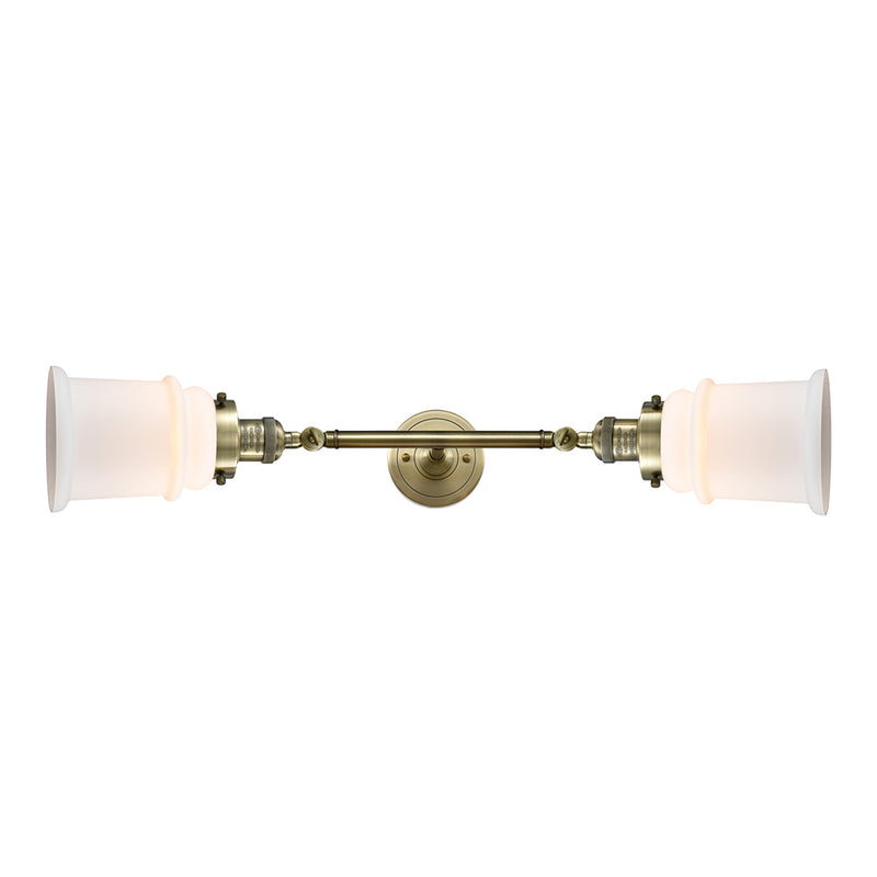 Canton Bath Vanity Light shown in the Antique Brass finish with a Matte White shade