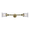 Canton Bath Vanity Light shown in the Antique Brass finish with a Clear shade