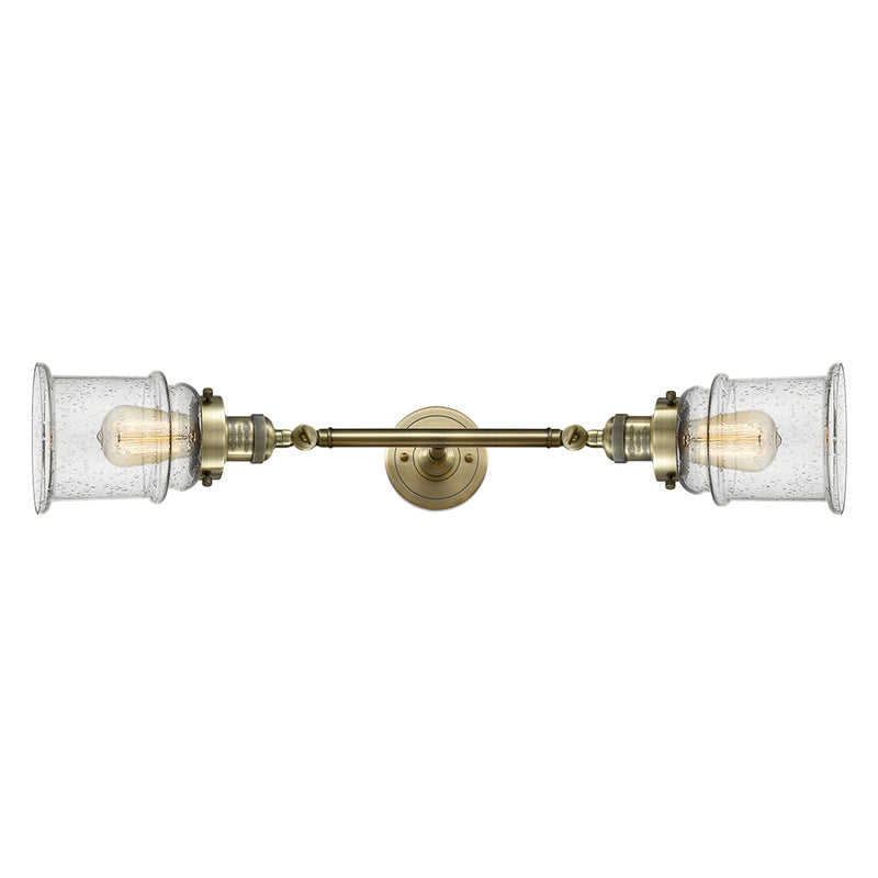 Canton Bath Vanity Light shown in the Antique Brass finish with a Seedy shade
