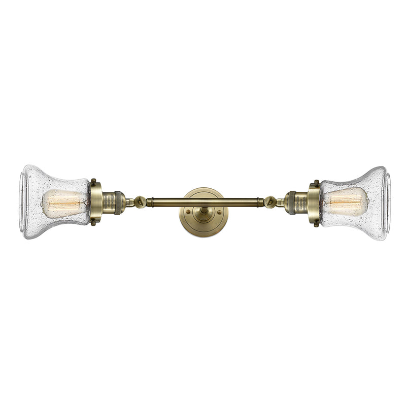 Bellmont Bath Vanity Light shown in the Antique Brass finish with a Seedy shade