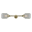 Stanton Bath Vanity Light shown in the Antique Brass finish with a Clear Wire Mesh shade