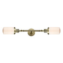 Dover Bath Vanity Light shown in the Antique Brass finish with a Matte White shade