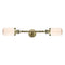 Dover Bath Vanity Light shown in the Antique Brass finish with a Matte White shade
