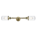 Dover Bath Vanity Light shown in the Antique Brass finish with a Clear shade