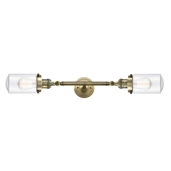 Dover Bath Vanity Light shown in the Antique Brass finish with a Clear shade