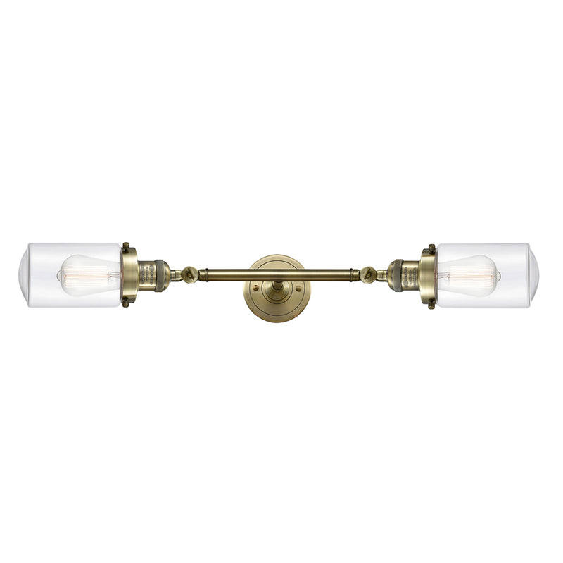 Dover Bath Vanity Light shown in the Antique Brass finish with a Clear shade