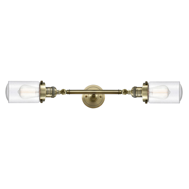 Dover Bath Vanity Light shown in the Antique Brass finish with a Seedy shade