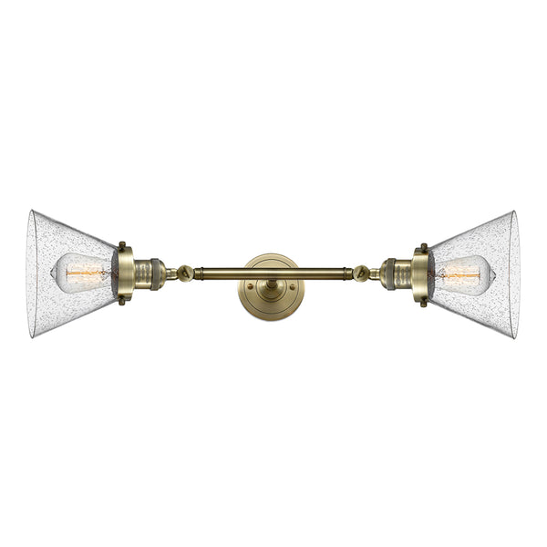 Cone Bath Vanity Light shown in the Antique Brass finish with a Seedy shade
