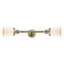 Bell Bath Vanity Light shown in the Antique Brass finish with a Matte White shade