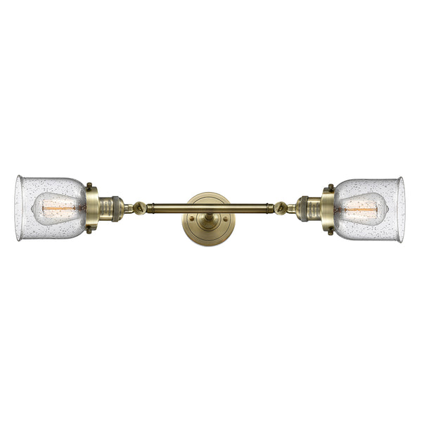 Bell Bath Vanity Light shown in the Antique Brass finish with a Seedy shade