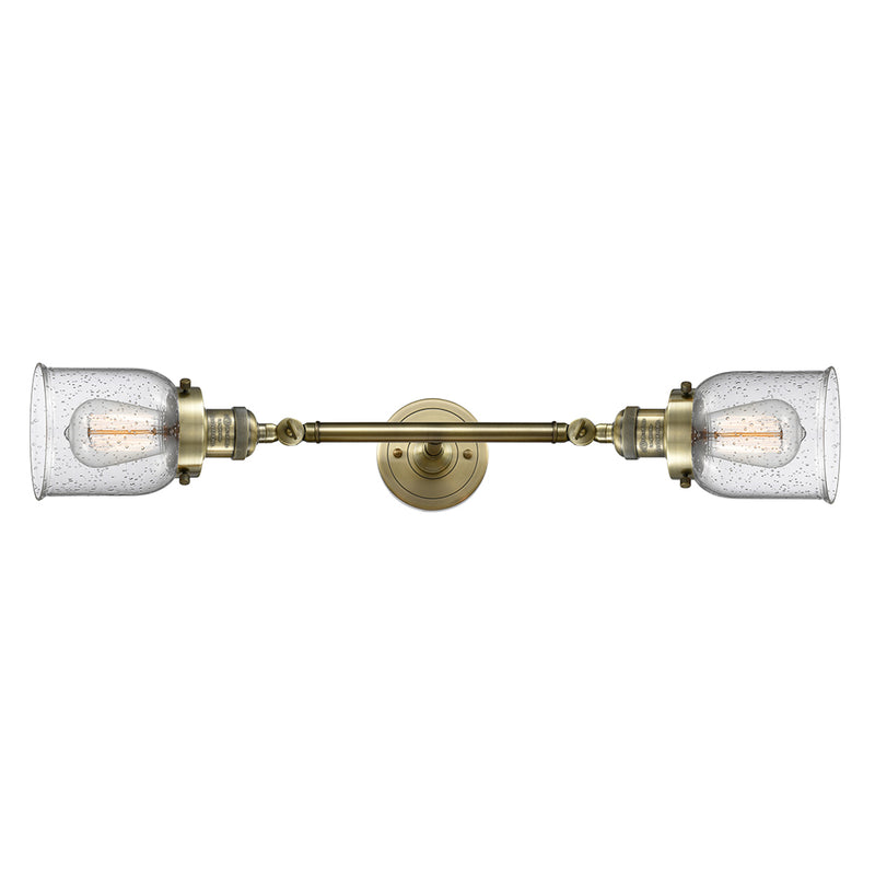 Bell Bath Vanity Light shown in the Antique Brass finish with a Seedy shade