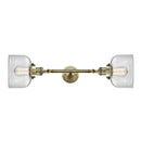 Bell Bath Vanity Light shown in the Antique Brass finish with a Clear shade