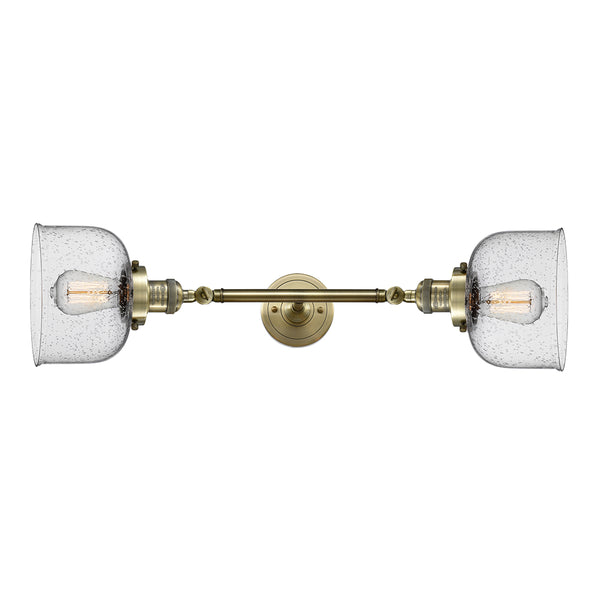 Bell Bath Vanity Light shown in the Antique Brass finish with a Seedy shade