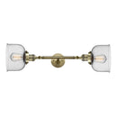 Bell Bath Vanity Light shown in the Antique Brass finish with a Seedy shade