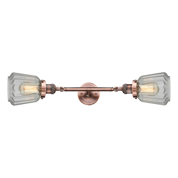 Chatham Bath Vanity Light shown in the Antique Copper finish with a Clear shade