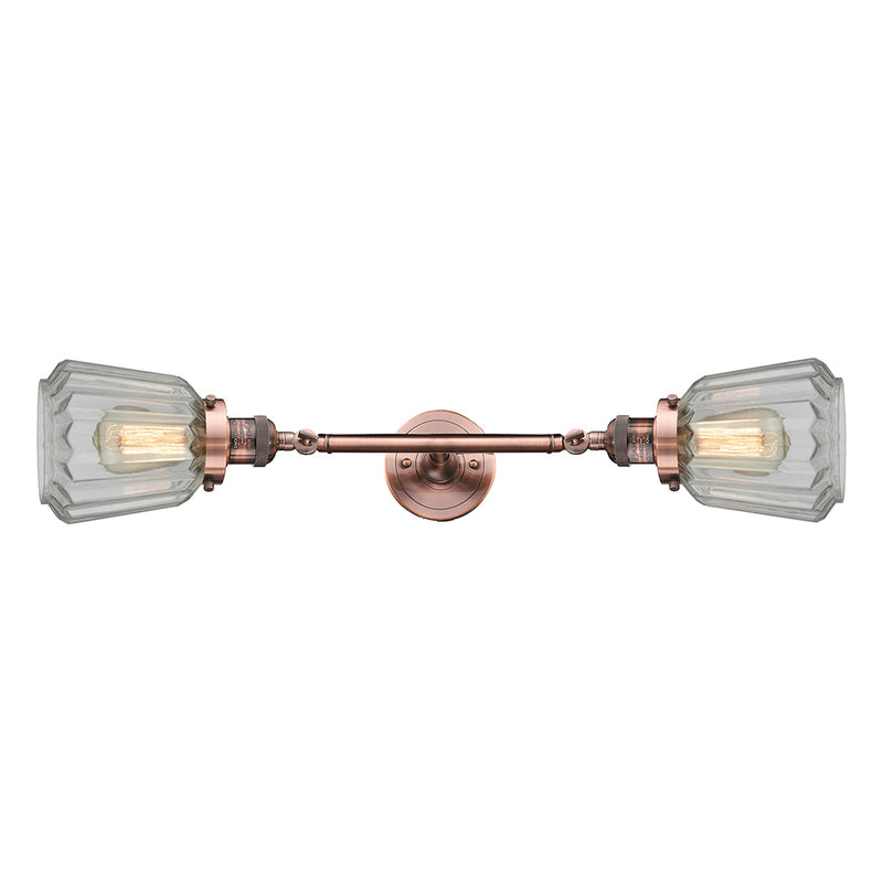 Chatham Bath Vanity Light shown in the Antique Copper finish with a Clear shade