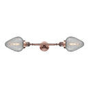 Geneseo Bath Vanity Light shown in the Antique Copper finish with a Clear Crackled shade