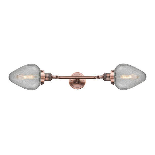 Geneseo Bath Vanity Light shown in the Antique Copper finish with a Clear Crackled shade