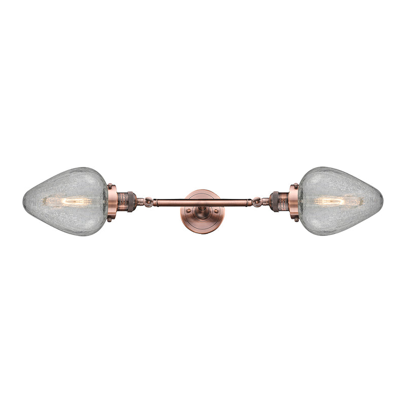 Geneseo Bath Vanity Light shown in the Antique Copper finish with a Clear Crackled shade