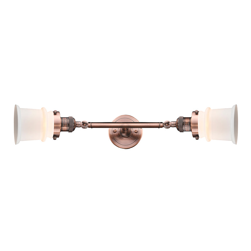 Canton Bath Vanity Light shown in the Antique Copper finish with a Matte White shade