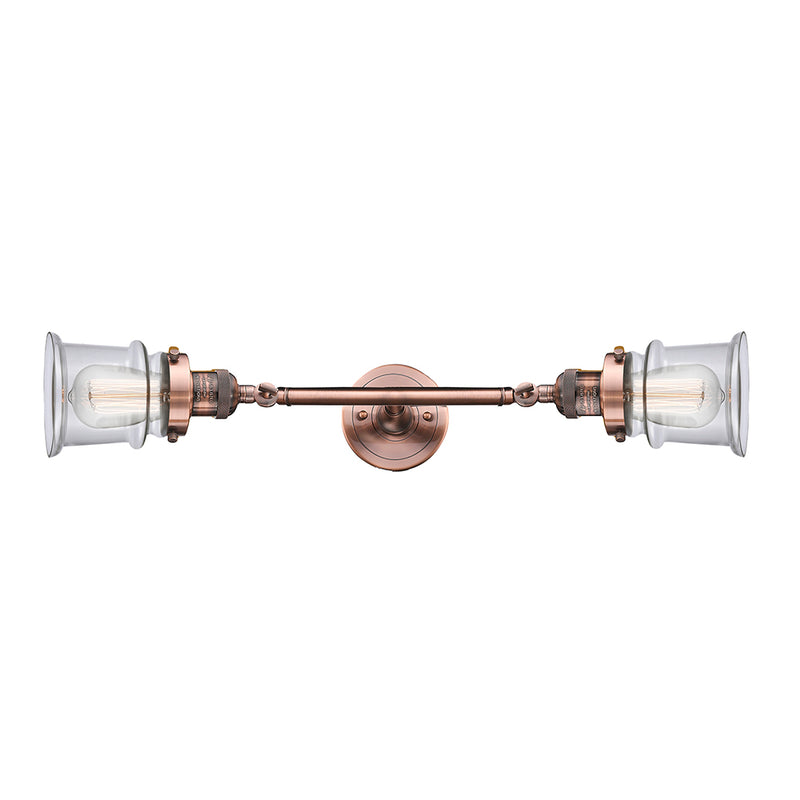 Canton Bath Vanity Light shown in the Antique Copper finish with a Clear shade