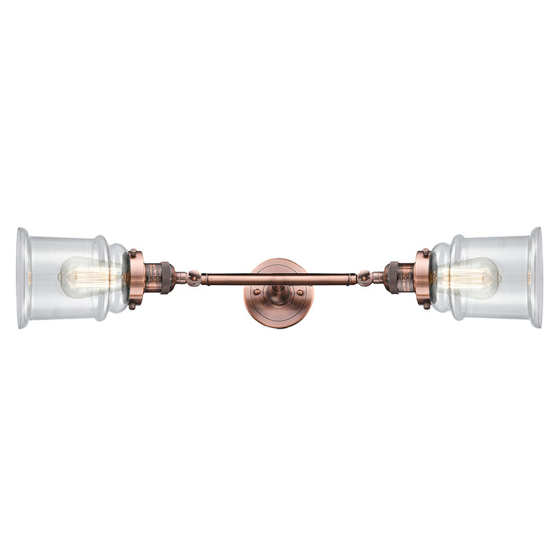 Canton Bath Vanity Light shown in the Antique Copper finish with a Clear shade