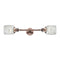 Colton Bath Vanity Light shown in the Antique Copper finish with a Clear Halophane shade