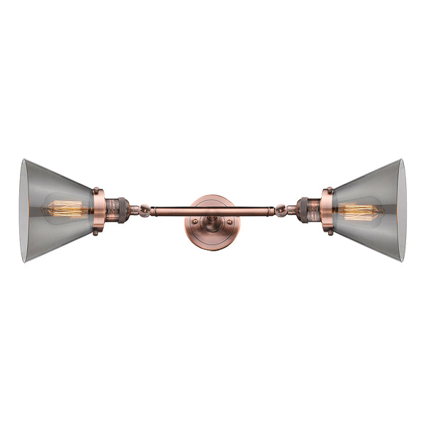Cone Bath Vanity Light shown in the Antique Copper finish with a Plated Smoke shade