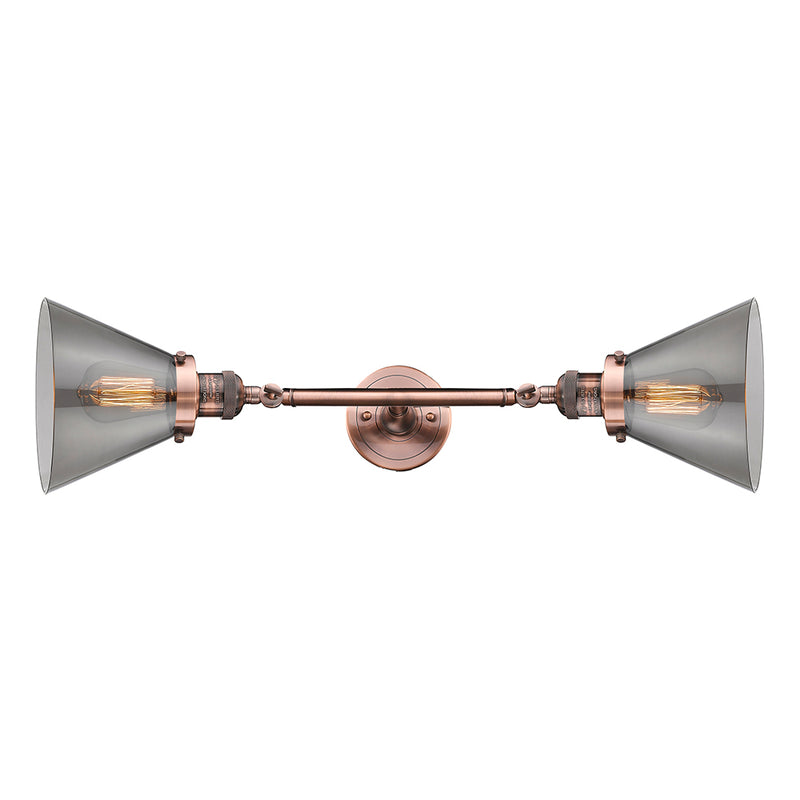 Cone Bath Vanity Light shown in the Antique Copper finish with a Plated Smoke shade