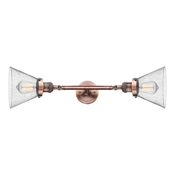 Cone Bath Vanity Light shown in the Antique Copper finish with a Seedy shade
