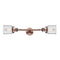 Bell Bath Vanity Light shown in the Antique Copper finish with a Clear shade