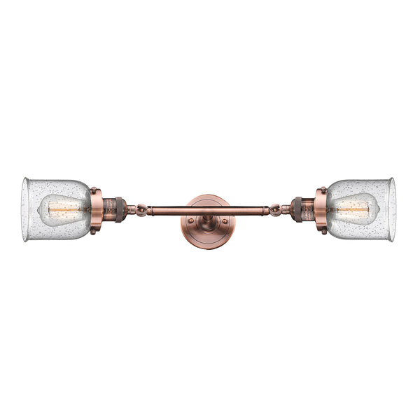 Bell Bath Vanity Light shown in the Antique Copper finish with a Seedy shade