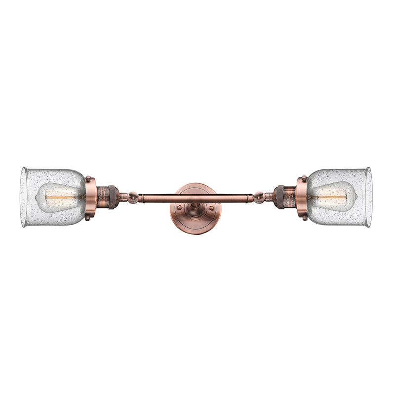 Bell Bath Vanity Light shown in the Antique Copper finish with a Seedy shade