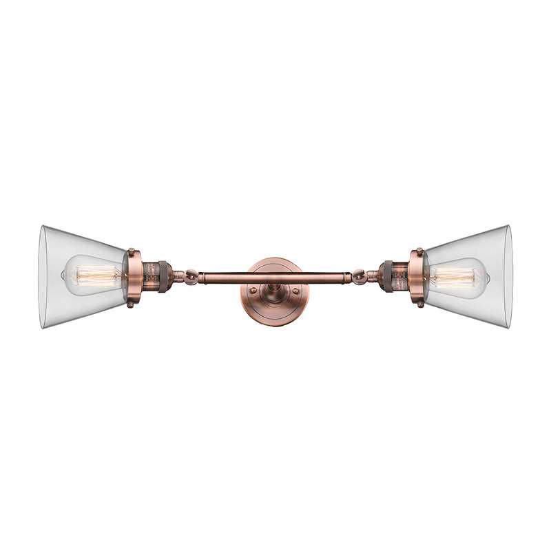 Cone Bath Vanity Light shown in the Antique Copper finish with a Clear shade