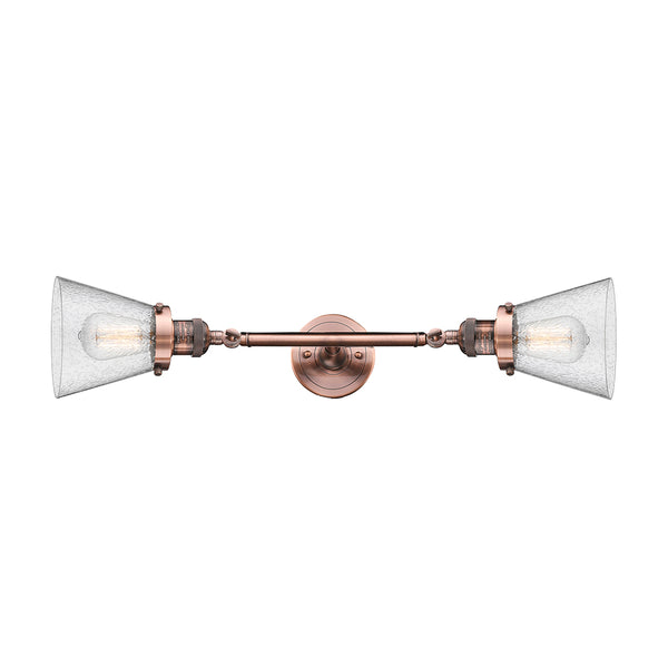 Cone Bath Vanity Light shown in the Antique Copper finish with a Seedy shade