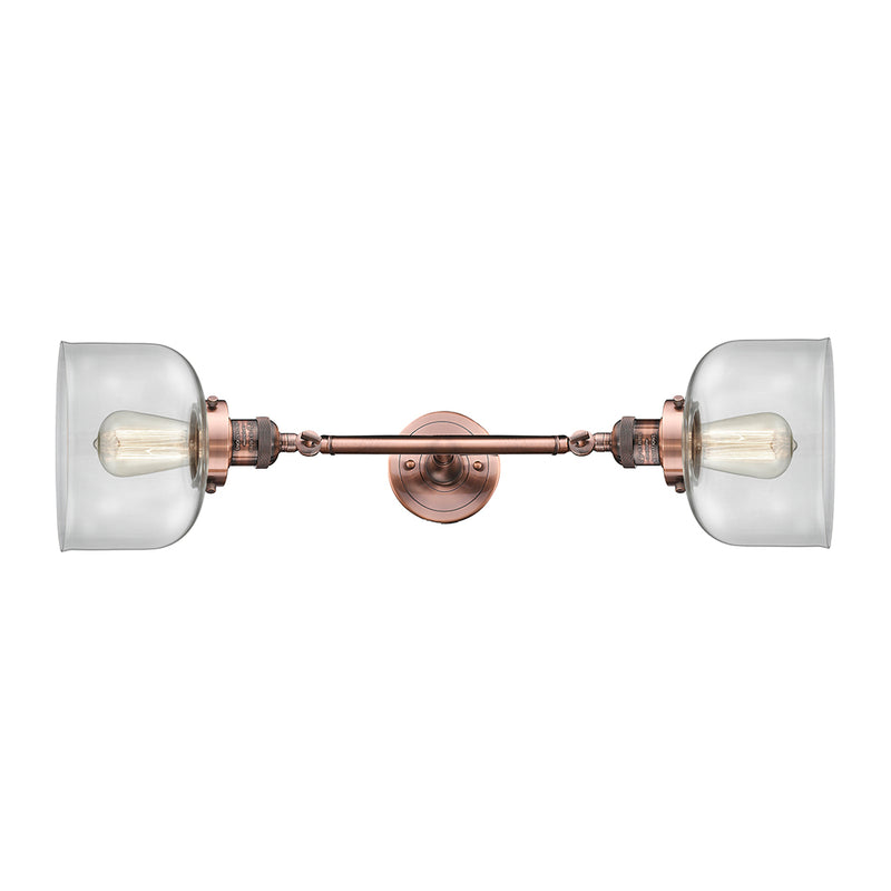 Bell Bath Vanity Light shown in the Antique Copper finish with a Clear shade