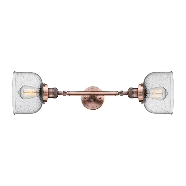 Bell Bath Vanity Light shown in the Antique Copper finish with a Seedy shade
