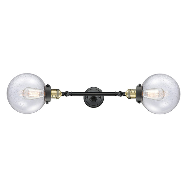 Beacon Bath Vanity Light shown in the Black Antique Brass finish with a Seedy shade