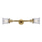 Canton Bath Vanity Light shown in the Brushed Brass finish with a Clear shade