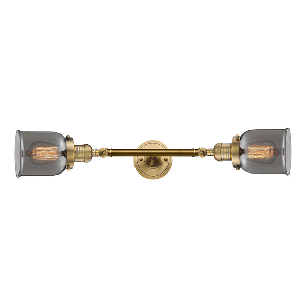 Bell Bath Vanity Light shown in the Brushed Brass finish with a Plated Smoke shade