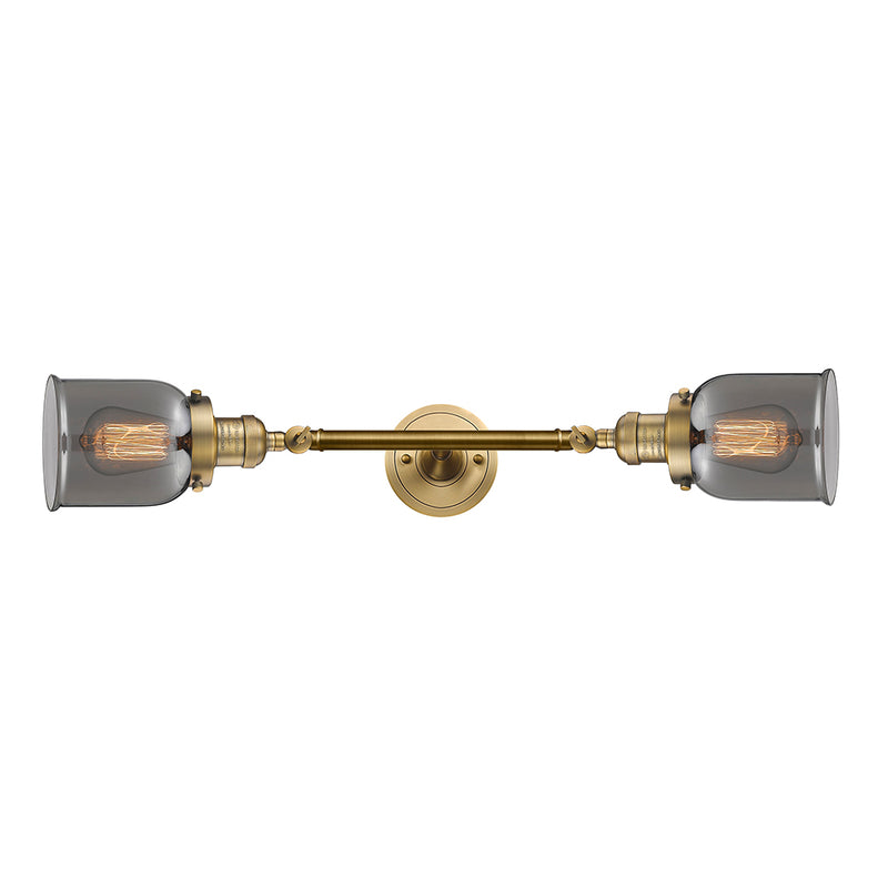 Bell Bath Vanity Light shown in the Brushed Brass finish with a Plated Smoke shade