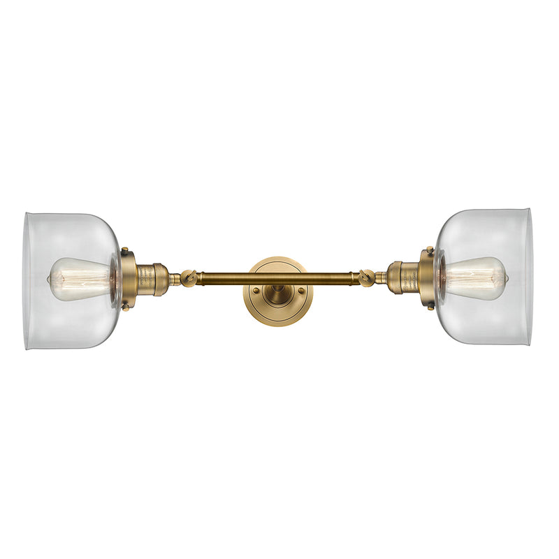 Bell Bath Vanity Light shown in the Brushed Brass finish with a Clear shade
