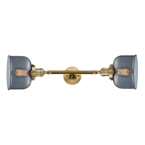 Bell Bath Vanity Light shown in the Brushed Brass finish with a Plated Smoke shade